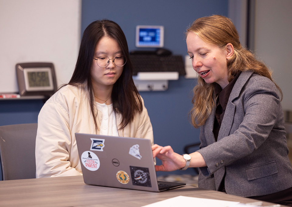 student and advisor talk over laptop