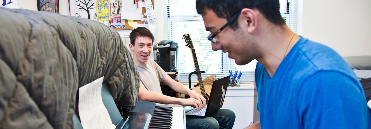 rooommates playing piano and studying