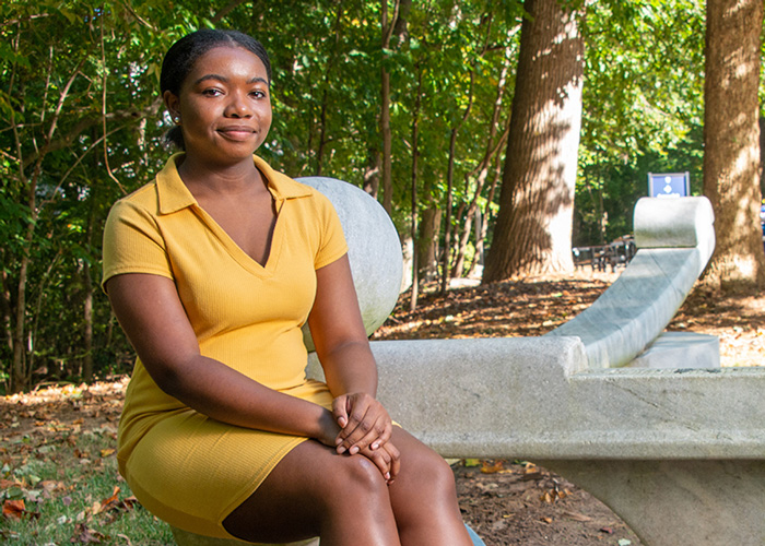 A student sitting outside