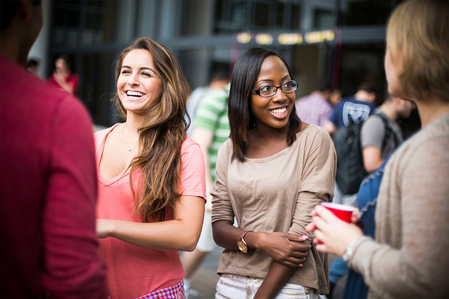 students chatting on campus