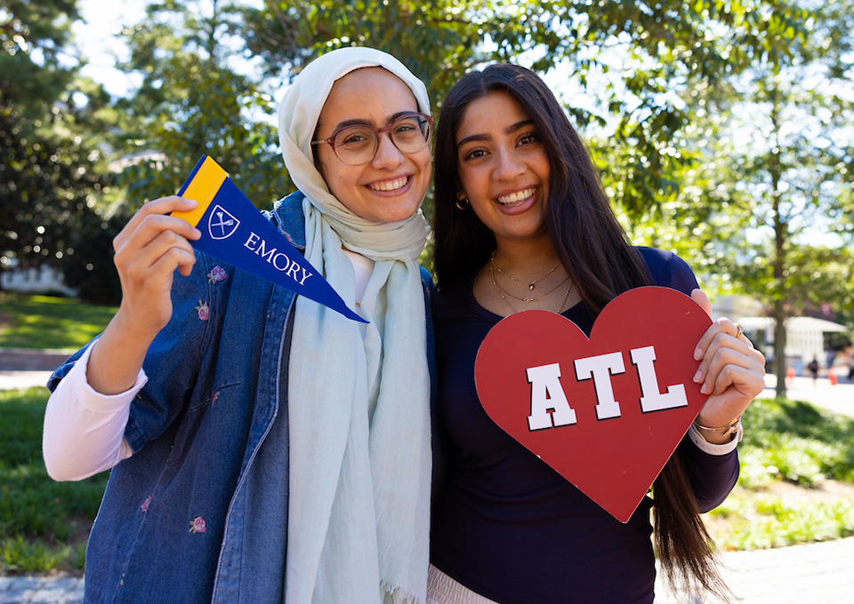 Students holding up props for a photo shoot