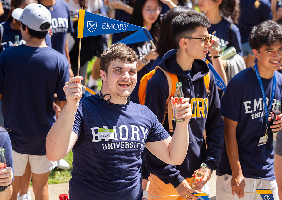 students waving pennants in a crowd