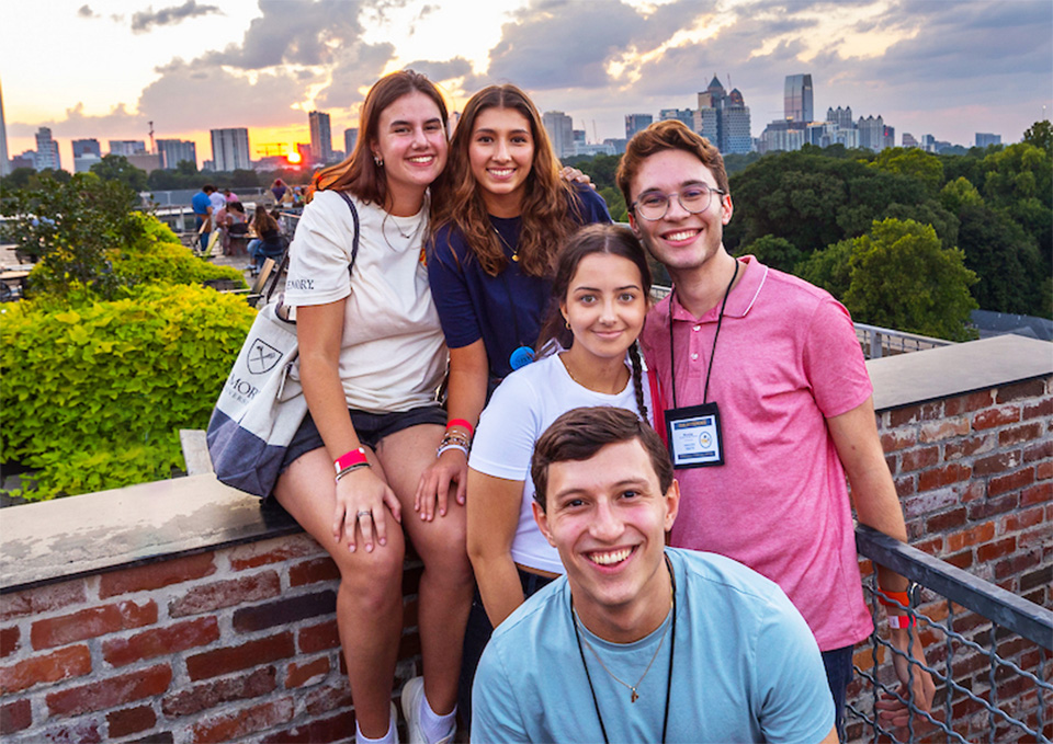 Students on the rooftop overlooking the Atlanta skyline