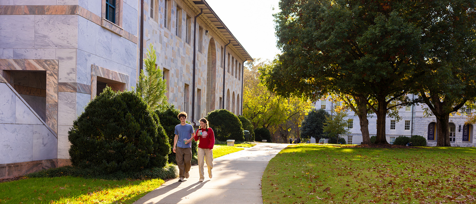 students walk along the quad